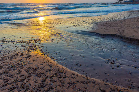 Beautiful sea waves in the morning sunrise.の写真素材