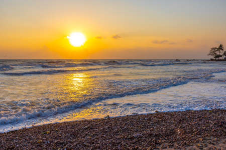 Beautiful sea waves in the morning sunrise.の写真素材