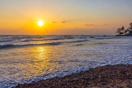 Beautiful sea waves in the morning sunrise.の写真素材