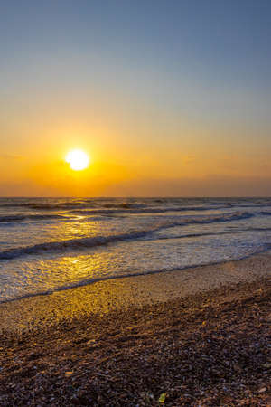 Beautiful sea waves in the morning sunrise.の写真素材