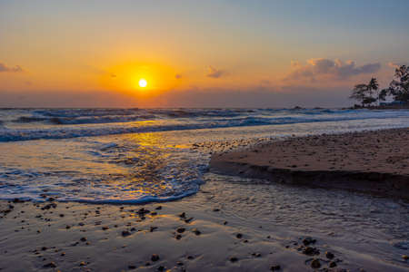 Beautiful sea waves in the morning sunrise.の写真素材