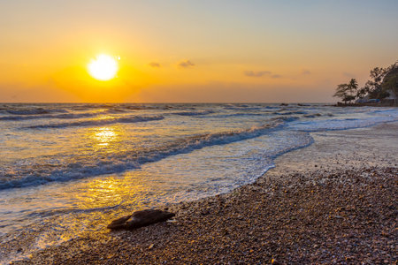 Beautiful sea waves in the morning sunrise.の写真素材