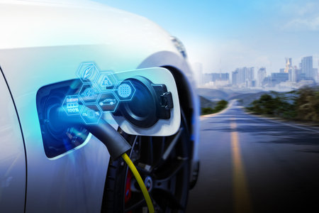 Power cable pump plug in charging power to electric vehicle EV car.の写真素材