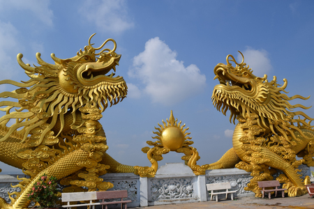 two big statue of golden dragon at Buddhist Chau Thoi temple, Binh Duong, Vietnamの写真素材
