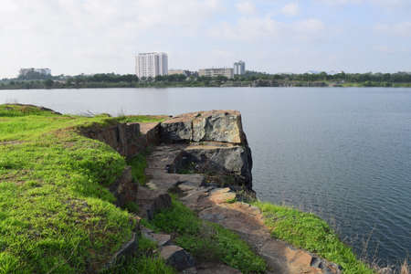 rocky lake with some stones and grass in the bank near Ho Chi Minh city, vietnam