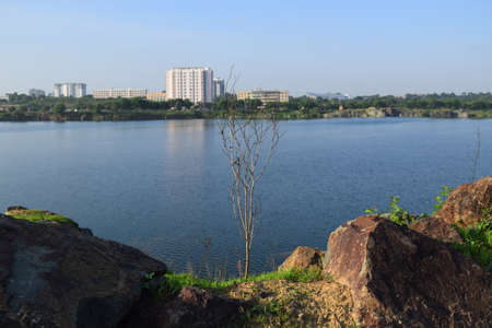 rocky lake with some stones and grass in the bank near Ho Chi Minh city, vietnamの写真素材
