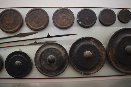 different kind of traditional gongs instrument and spear in museum of vietnamのeditorial素材