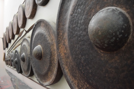 different kind of traditional gongs instrument and spear in museum of vietnamのeditorial素材