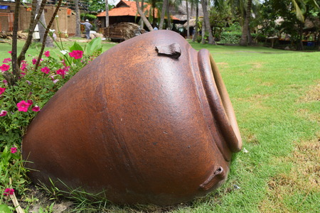 landscaping garden with big pottery jar decorationの写真素材