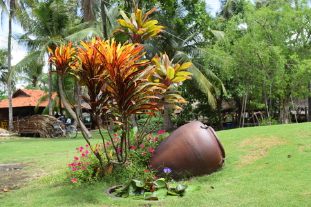 landscaping garden with big pottery jar decorationの写真素材