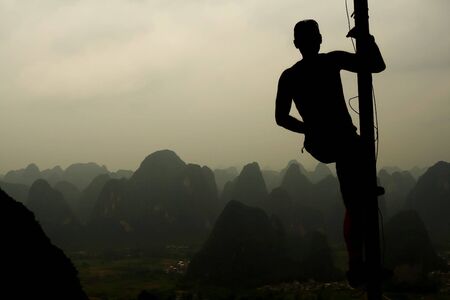 man on the top of mountainの写真素材
