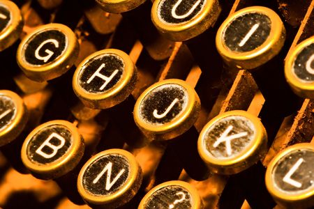 detail of golden typewriter, close up on keysの写真素材