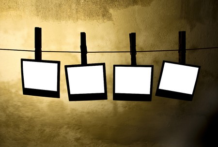 classic old photos Held By Clothespins with grunge backgroundの写真素材