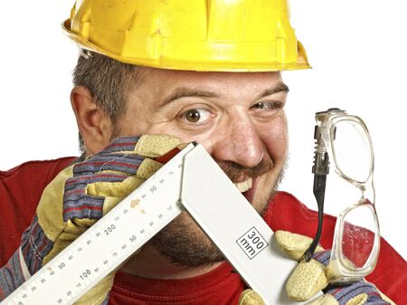 young caucasian handyman check misure on his intrument