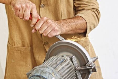 detail of classic industrial grindstone , make the tool sharp