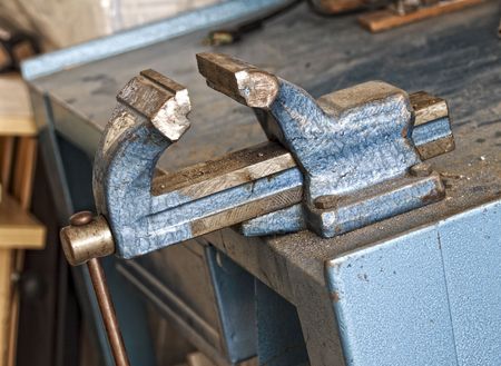 fine detail of classic blue old banch vice on work placeの写真素材