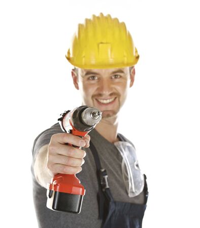 isolated friendly handyman with red drill, selective focusの写真素材