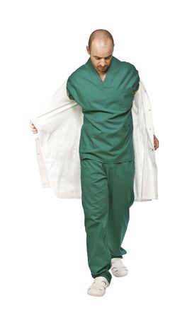young caucasian doctor take off his white clothes の写真素材