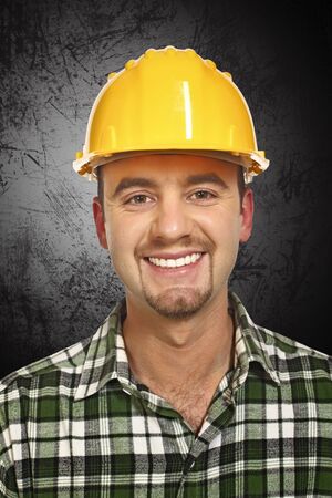 smiling handyman portrait and dark grunge background
