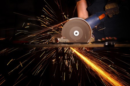 detail of electric grinder tool in actionの写真素材