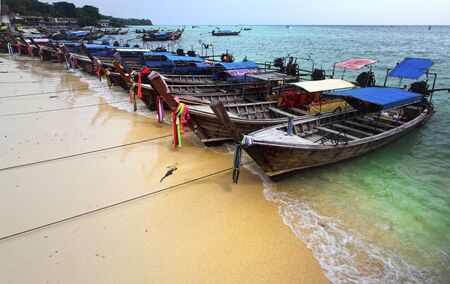 long tail boat on krabi beach, phi phi island in thailand