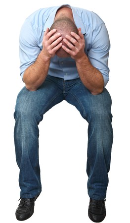 desperate sit man isolated on white backgroundの写真素材