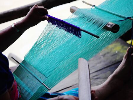detail of traditional thai loom at work