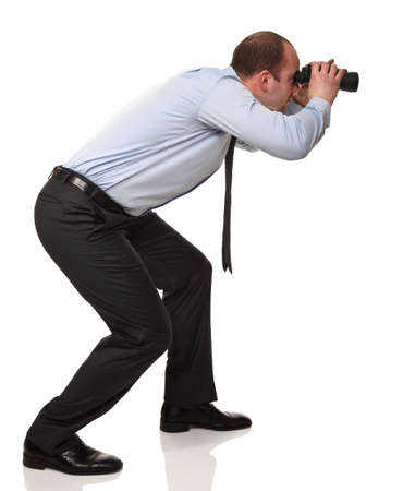 active businessman with binocular isolated on whiteの写真素材