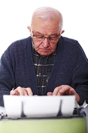 portrait of caucasian ol man and vintage typewriterの写真素材