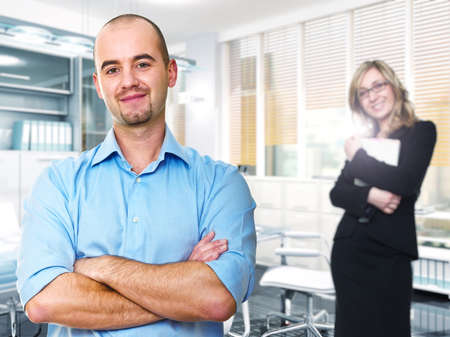portrait of man and woman in office selective focus imageの写真素材