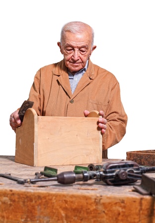 fine portrait of senior carpenter at workの写真素材
