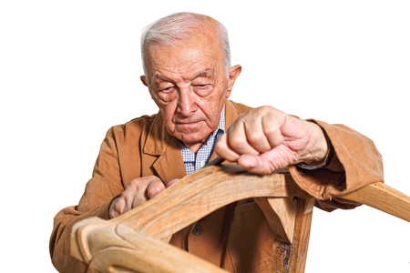 fine portrait of senior carpenter at workの写真素材