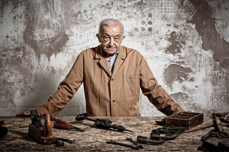 portrait of aged carpente at workの写真素材