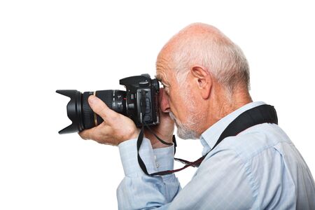 portrait of senior caucasian man with camera isolated on whiteの写真素材