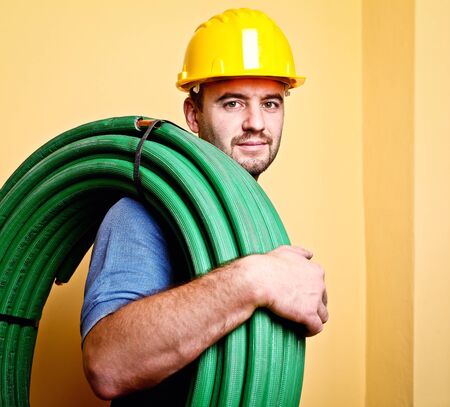 portrait of caucasian manual worker with pipe