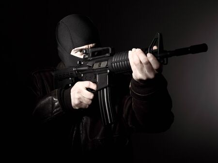 portrait of criminal with m4 rifle 