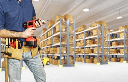 worker in warehouse detail on tools