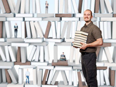 smiling man hold pile of books