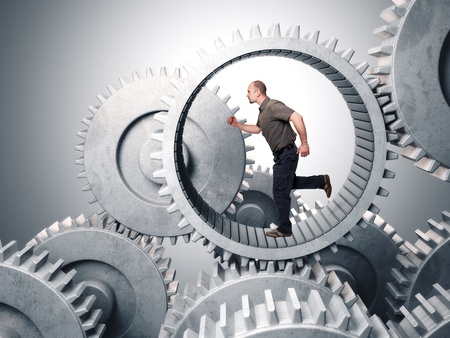 caucasian man run inside metal gearの写真素材