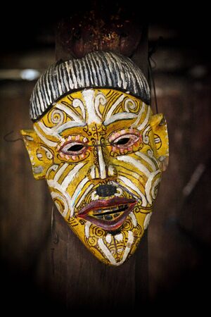 asian ethnic mask and dark backgroundの写真素材