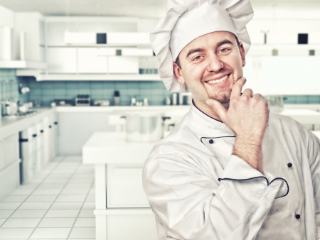 friendly chef in modern kitchenの写真素材