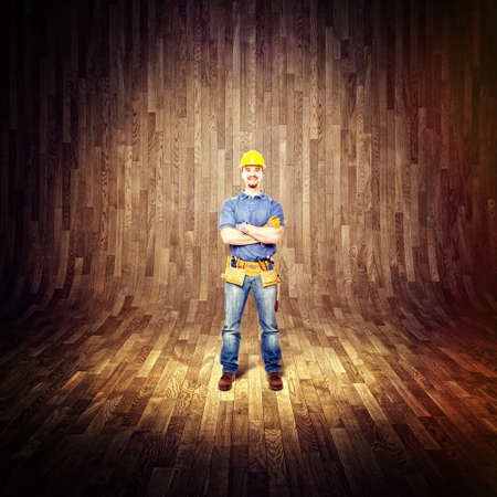 standing handyman an 3d wood backgroundの写真素材