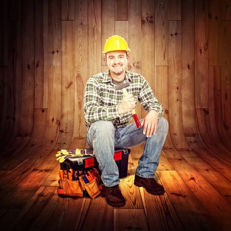 carpenter portrait and wood backgroundの写真素材