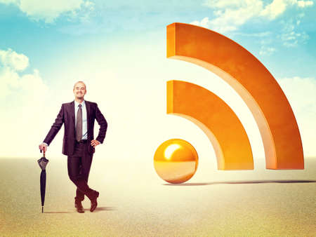 smiling businessman and 3d huge rss logoの写真素材