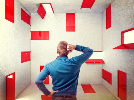 caucasian man and 3d red abstract doorsの写真素材