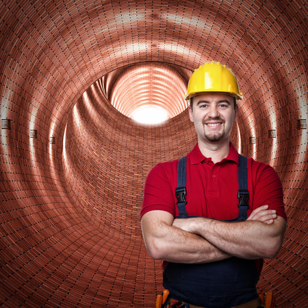 handyman in a brick tunnel