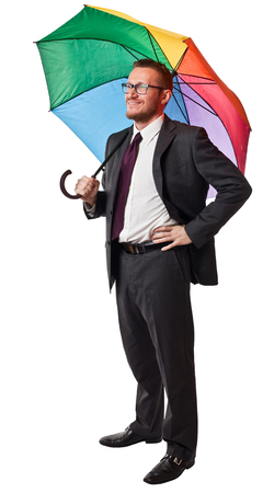 smiling businessman with rainbow umbrella isolated on whiteの写真素材