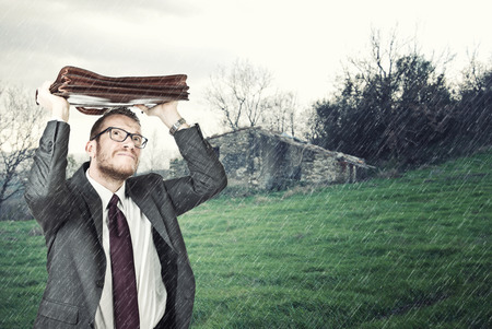 businessman outdoor and heavy rainの写真素材