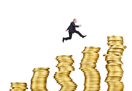 man jump on pile of euro coin の写真素材