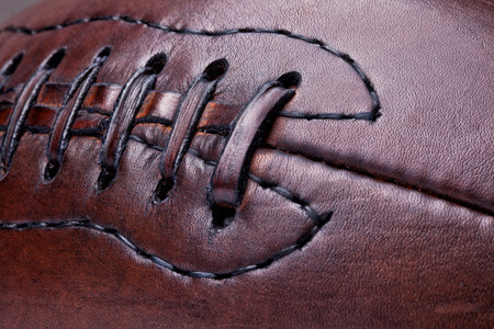 classic old leather football backgroundの写真素材
